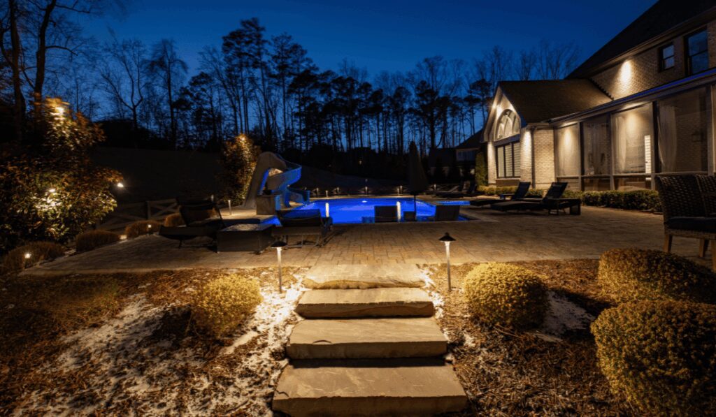 Residential landscape lighting illuminating a backyard with LED lights